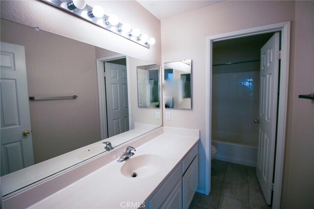1680 Elmbridge Ln, Hemet, CA 92545 - full bath with toilet, tile patterned flooring, vanity, and shower / washtub combination