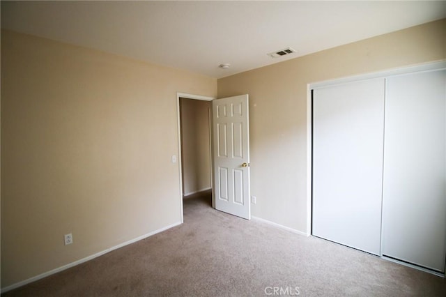 1680 Elmbridge Ln, Hemet, CA 92545 - unfurnished bedroom with carpet flooring, baseboards, and a closet