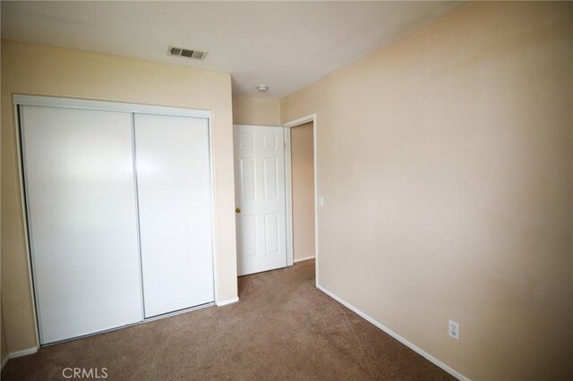 1680 Elmbridge Ln, Hemet, CA 92545 - unfurnished bedroom with carpet flooring, baseboards, and a closet