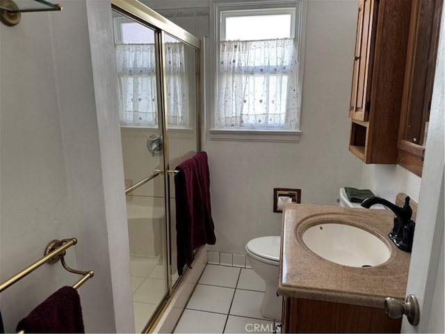 full bathroom with tile patterned flooring, a stall shower, vanity, and toilet