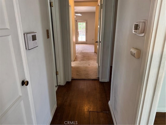 corridor with dark wood-style floors
