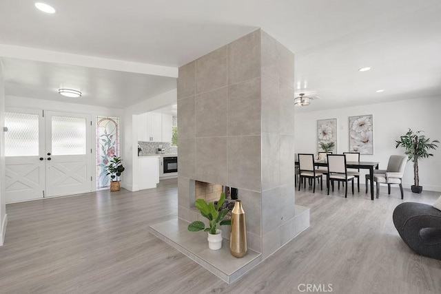 18211 Fairhaven Ave, North Tustin, CA 92705 - living area featuring light wood-style floors, recessed lighting, a fireplace, and baseboards