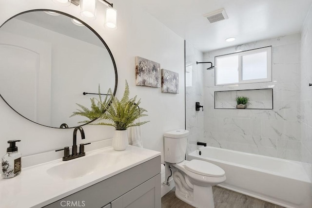 18211 Fairhaven Ave, North Tustin, CA 92705 - bathroom featuring vanity, bathtub / shower combination, toilet, and wood finished floors