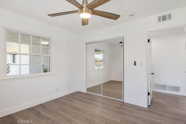 18211 Fairhaven Ave, North Tustin, CA 92705 - unfurnished bedroom featuring wood finished floors, baseboards, and a closet