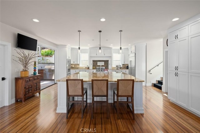 863 Greystone Pl, San Luis Obispo, CA 93401 - kitchen with white cabinets, tasteful backsplash, dark wood-style flooring, and recessed lighting