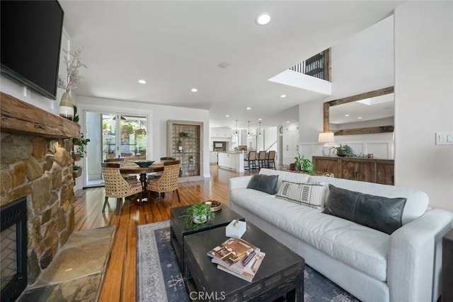863 Greystone Pl, San Luis Obispo, CA 93401 - living area with a stone fireplace, wood finished floors, and recessed lighting