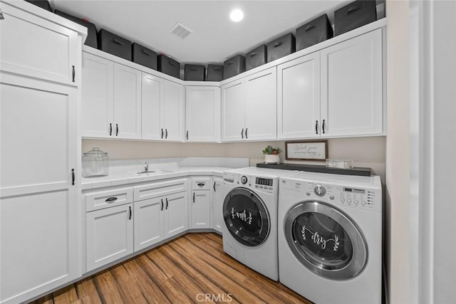 863 Greystone Pl, San Luis Obispo, CA 93401 - washroom featuring independent washer and dryer, cabinet space, wood finished floors, and recessed lighting