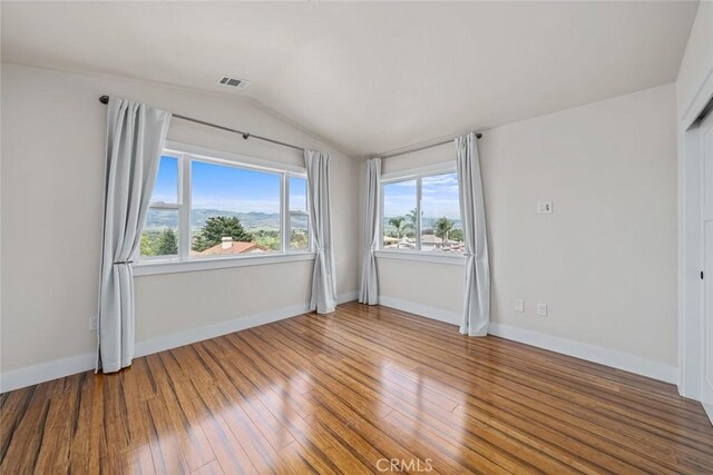 863 Greystone Pl, San Luis Obispo, CA 93401 - empty room with vaulted ceiling, plenty of natural light, wood finished floors, and baseboards