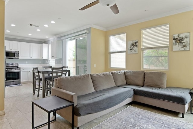 9229 Maywood Way, Riverside, CA 92503 - living area with crown molding, plenty of natural light, ceiling fan, and recessed lighting