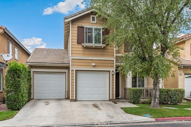 9229 Maywood Way, Riverside, CA 92503 - view of front of house featuring driveway, a tiled roof, and an attached garage