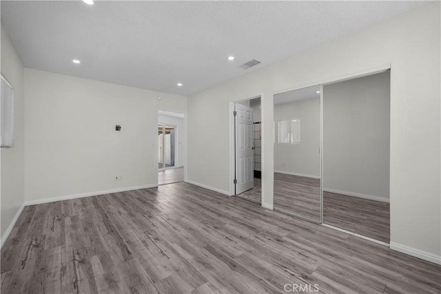 10117 Sharp Ave, Arleta, CA 91331 - unfurnished bedroom featuring wood finished floors, recessed lighting, baseboards, and a closet