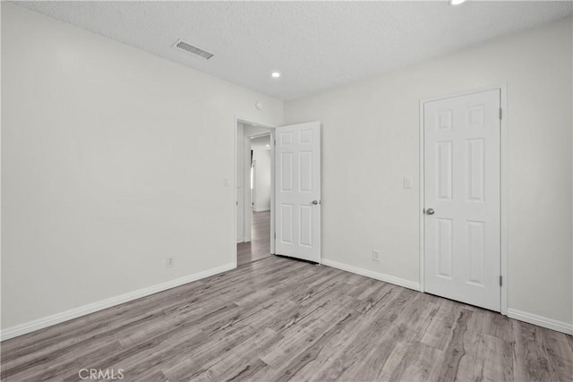 10117 Sharp Ave, Arleta, CA 91331 - unfurnished bedroom with wood finished floors, recessed lighting, baseboards, and a textured ceiling