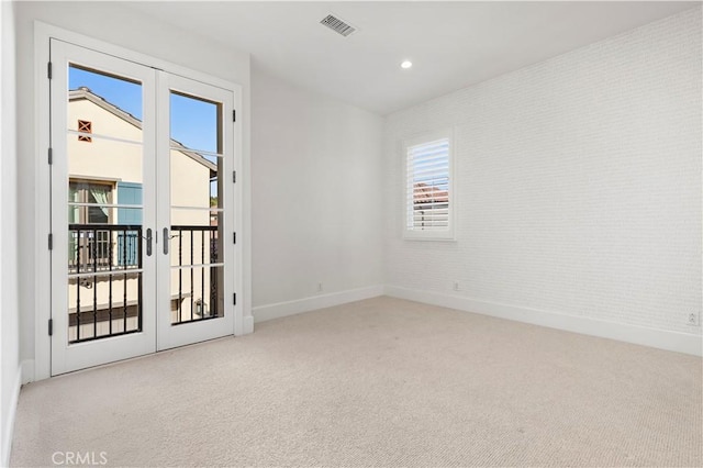 unfurnished room with french doors, carpet flooring, baseboards, and recessed lighting