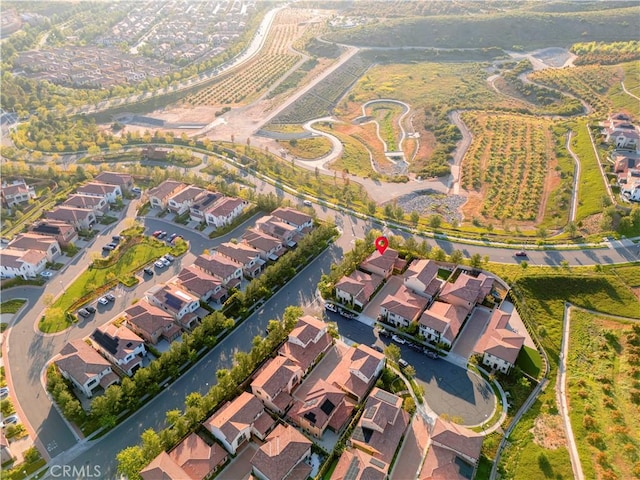 aerial view of property's location featuring nearby suburban area