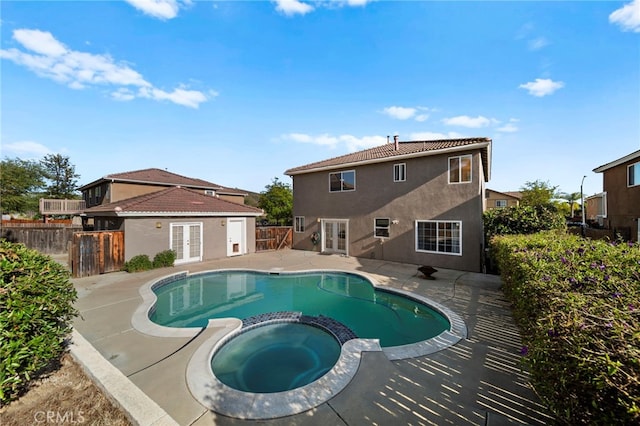 27876 Twilight Ct, Murrieta, CA 92563 - view of swimming pool featuring french doors, a pool with connected hot tub, a patio area, and a fenced backyard