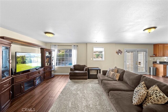 27876 Twilight Ct, Murrieta, CA 92563 - living area featuring dark wood-style flooring, a textured ceiling, and baseboards
