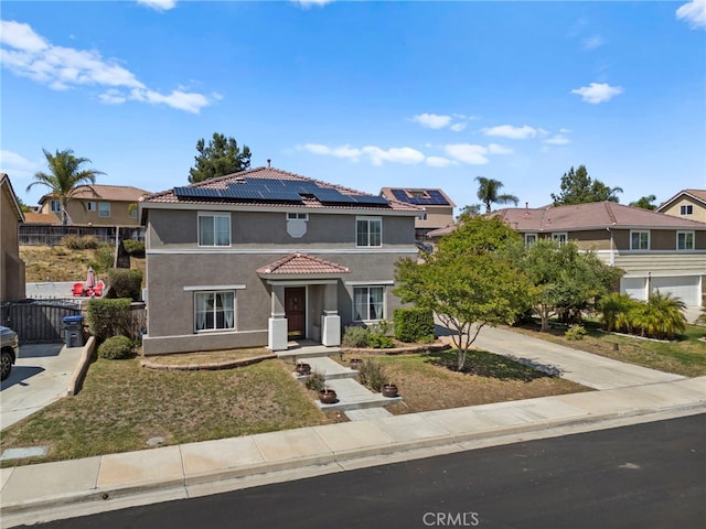 27876 Twilight Ct, Murrieta, CA 92563 - view of front of property featuring stucco siding, a tiled roof, roof mounted solar panels, concrete driveway, and a residential view
