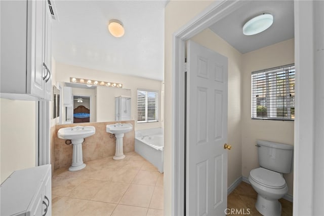 27876 Twilight Ct, Murrieta, CA 92563 - full bath with healthy amount of natural light, a bath, toilet, and tile patterned floors
