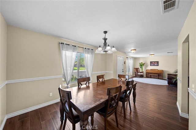 27876 Twilight Ct, Murrieta, CA 92563 - dining room featuring a chandelier and dark wood-type flooring