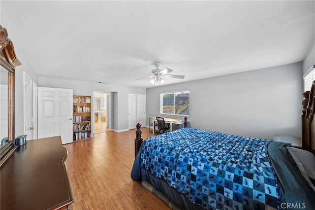 27876 Twilight Ct, Murrieta, CA 92563 - bedroom featuring multiple windows, wood finished floors, and a ceiling fan