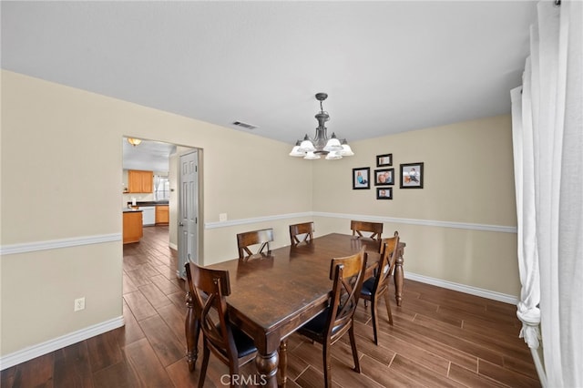27876 Twilight Ct, Murrieta, CA 92563 - dining room featuring dark wood-style flooring and a chandelier