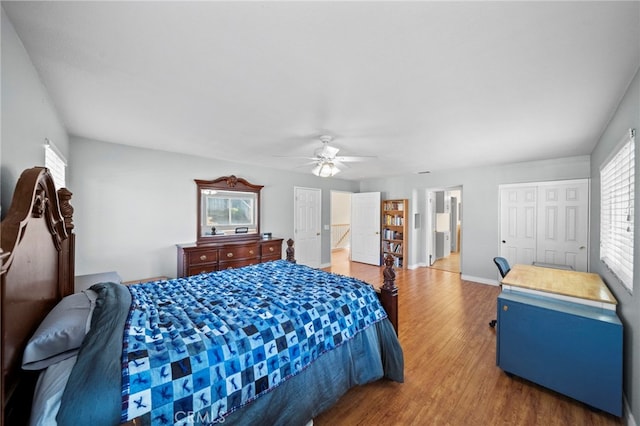 27876 Twilight Ct, Murrieta, CA 92563 - bedroom with wood finished floors, multiple windows, baseboards, and ceiling fan