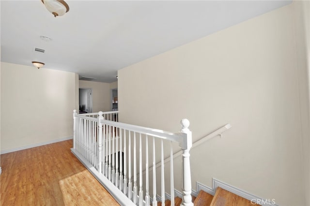 27876 Twilight Ct, Murrieta, CA 92563 - hallway featuring an upstairs landing, wood finished floors, and baseboards
