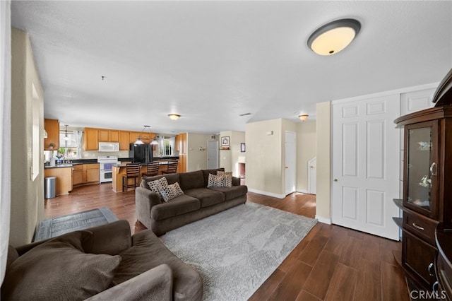 27876 Twilight Ct, Murrieta, CA 92563 - living room with dark wood-style flooring and baseboards
