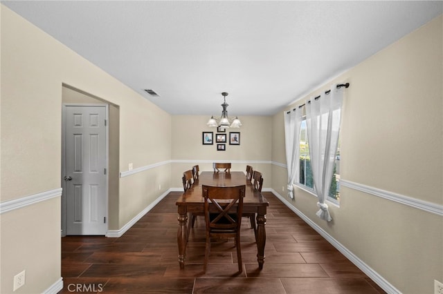 27876 Twilight Ct, Murrieta, CA 92563 - dining space with a chandelier, baseboards, and dark wood-type flooring