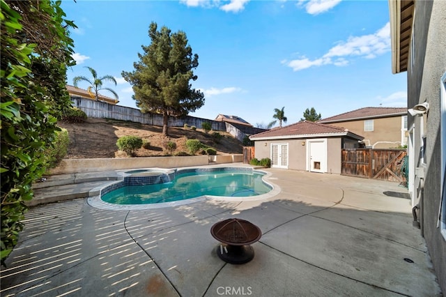 27876 Twilight Ct, Murrieta, CA 92563 - view of pool with a patio, a fenced backyard, french doors, and an outbuilding