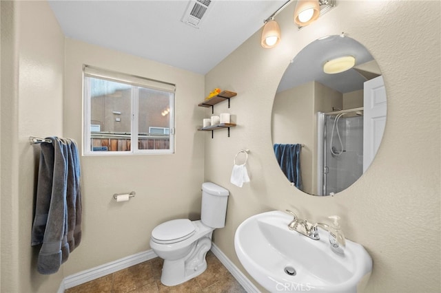 27876 Twilight Ct, Murrieta, CA 92563 - full bath featuring a sink, an enclosed shower, baseboards, toilet, and tile patterned floors