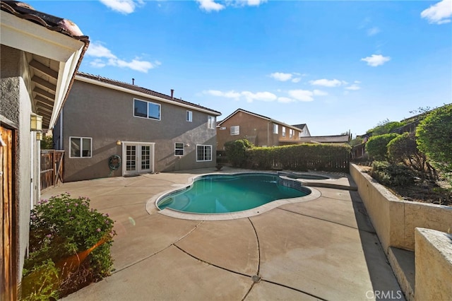 27876 Twilight Ct, Murrieta, CA 92563 - view of pool featuring a patio, a fenced backyard, french doors, and a pool with connected hot tub