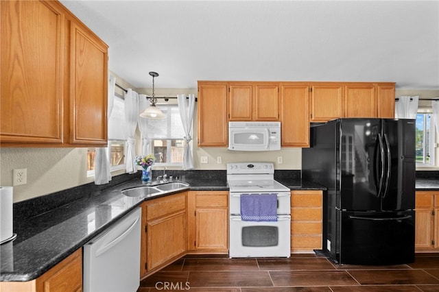 27876 Twilight Ct, Murrieta, CA 92563 - kitchen with white appliances, wood finish floors, hanging light fixtures, and dark stone counters