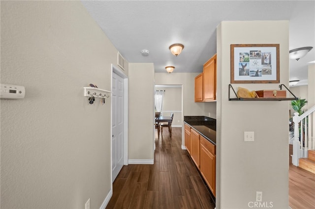27876 Twilight Ct, Murrieta, CA 92563 - hall with dark wood-style floors and baseboards