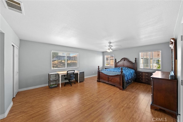 27876 Twilight Ct, Murrieta, CA 92563 - bedroom with wood finished floors, ceiling fan, a desk, and baseboards