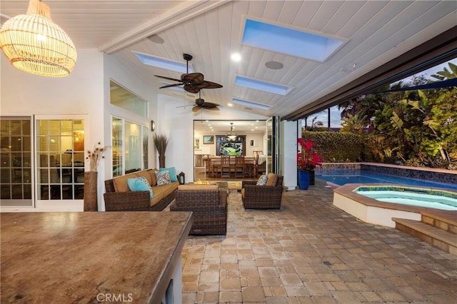 outdoor pool featuring a patio area, an in-ground hot tub, a ceiling fan, and an outdoor living space