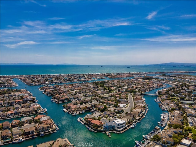 aerial view of residential area featuring a nearby body of water