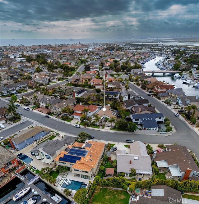 aerial view of residential area with a large body of water