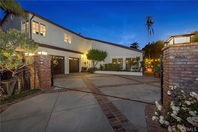 view of front of house with driveway and a garage