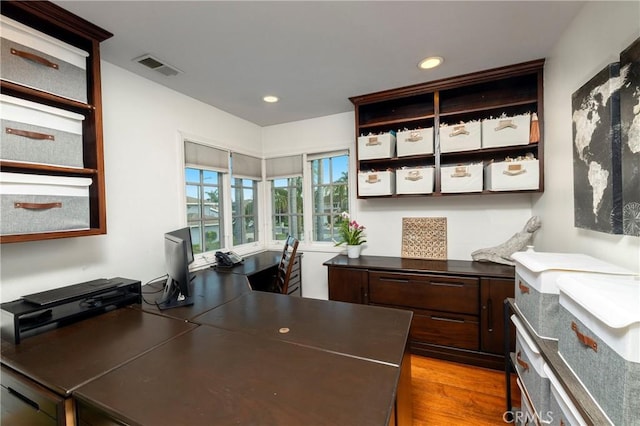 home office featuring wood finished floors and recessed lighting
