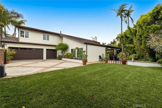 view of front facade featuring a front lawn, concrete driveway, and an attached garage