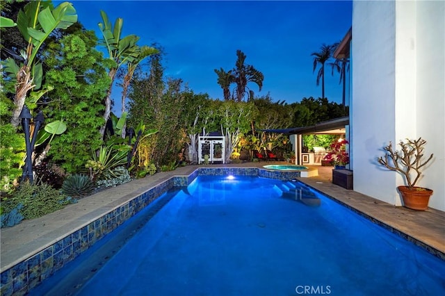 view of pool featuring a pool with connected hot tub