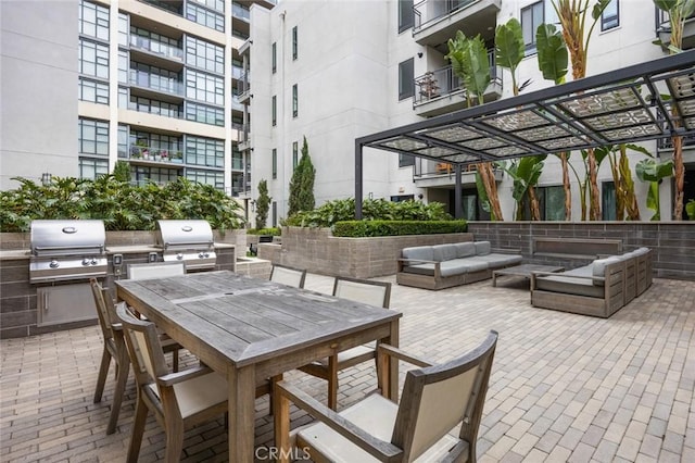 view of patio featuring area for grilling, outdoor lounge area, and outdoor dining area