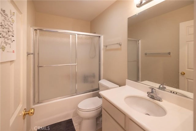 full bathroom with toilet, vanity, and combined bath / shower with glass door