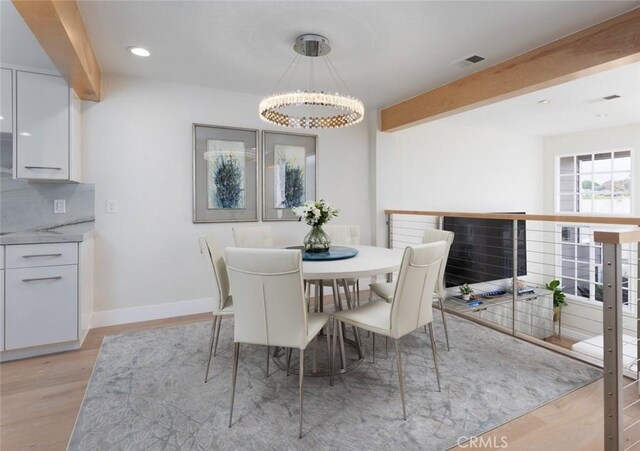 33156 Ocean Bright, Dana Point, CA 92629 - dining area with a chandelier, light wood-type flooring, beam ceiling, baseboards, and recessed lighting