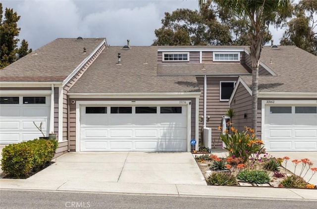 33156 Ocean Bright, Dana Point, CA 92629 - view of front of home featuring concrete driveway, roof with shingles, and a garage