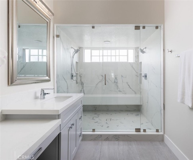 33156 Ocean Bright, Dana Point, CA 92629 - bathroom with a marble finish shower, vanity, and baseboards