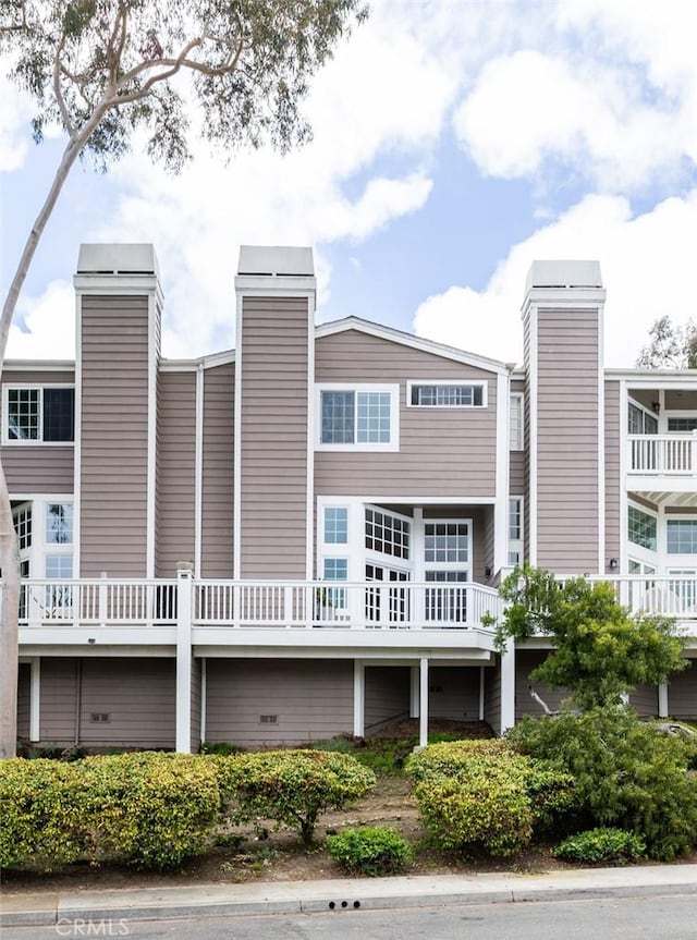 33156 Ocean Bright, Dana Point, CA 92629 - back of house featuring a chimney
