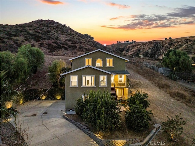 28637 Chiquito Canyon Rd, Castaic, CA 91384 - view of front facade with stairs, driveway, stucco siding, and a mountain view