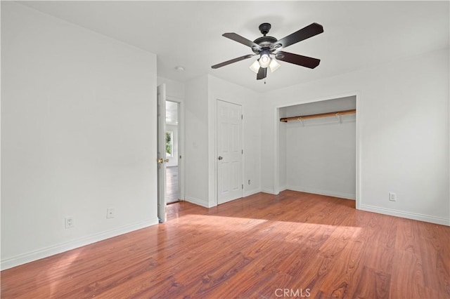 28637 Chiquito Canyon Rd, Castaic, CA 91384 - unfurnished bedroom featuring baseboards, wood finished floors, a closet, and a ceiling fan